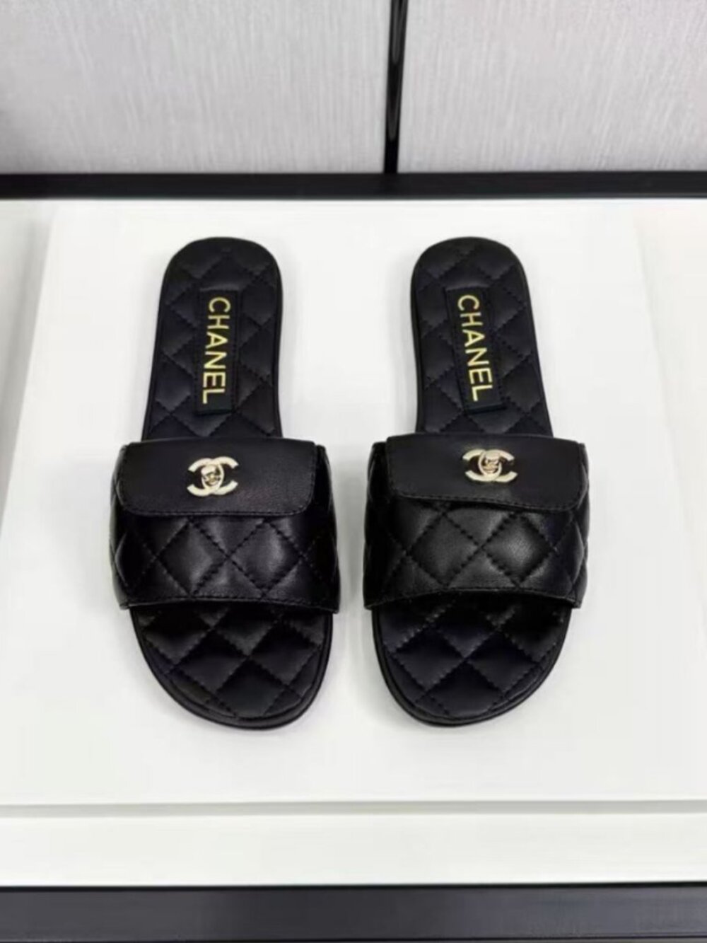CHANEL Black Quilted Lambskin CC Turn‑Lock Flat Slide Sandals